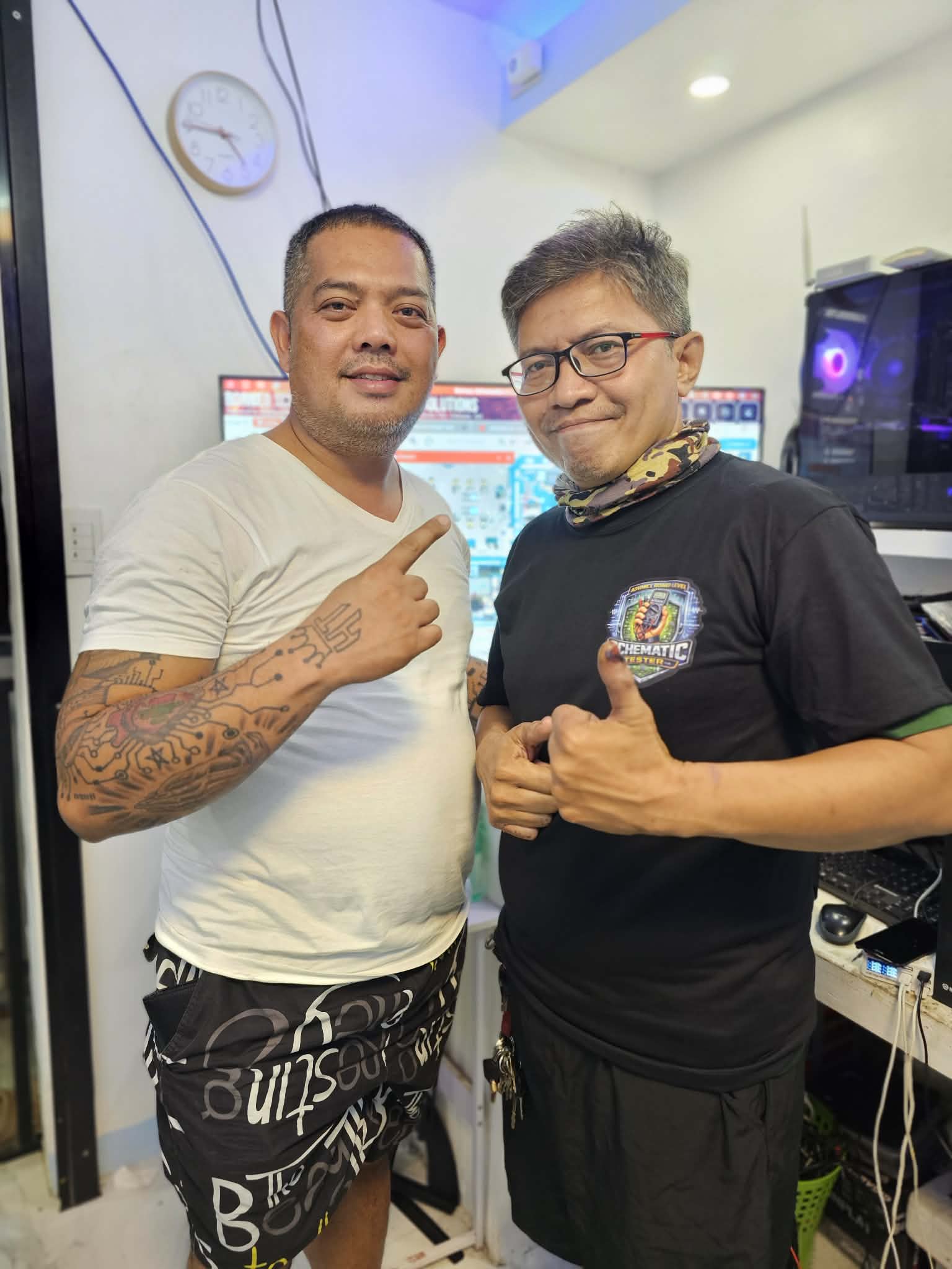 Two people posing together inside the training lab.