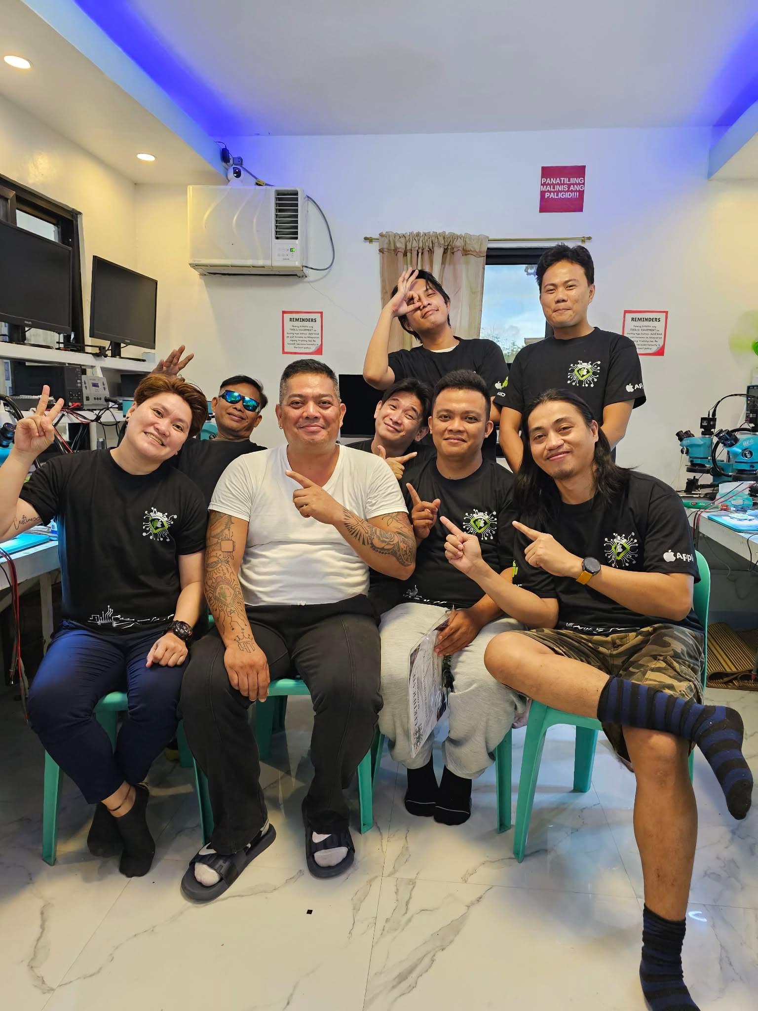 Group photo of trainees seated in the HardTech training lab.